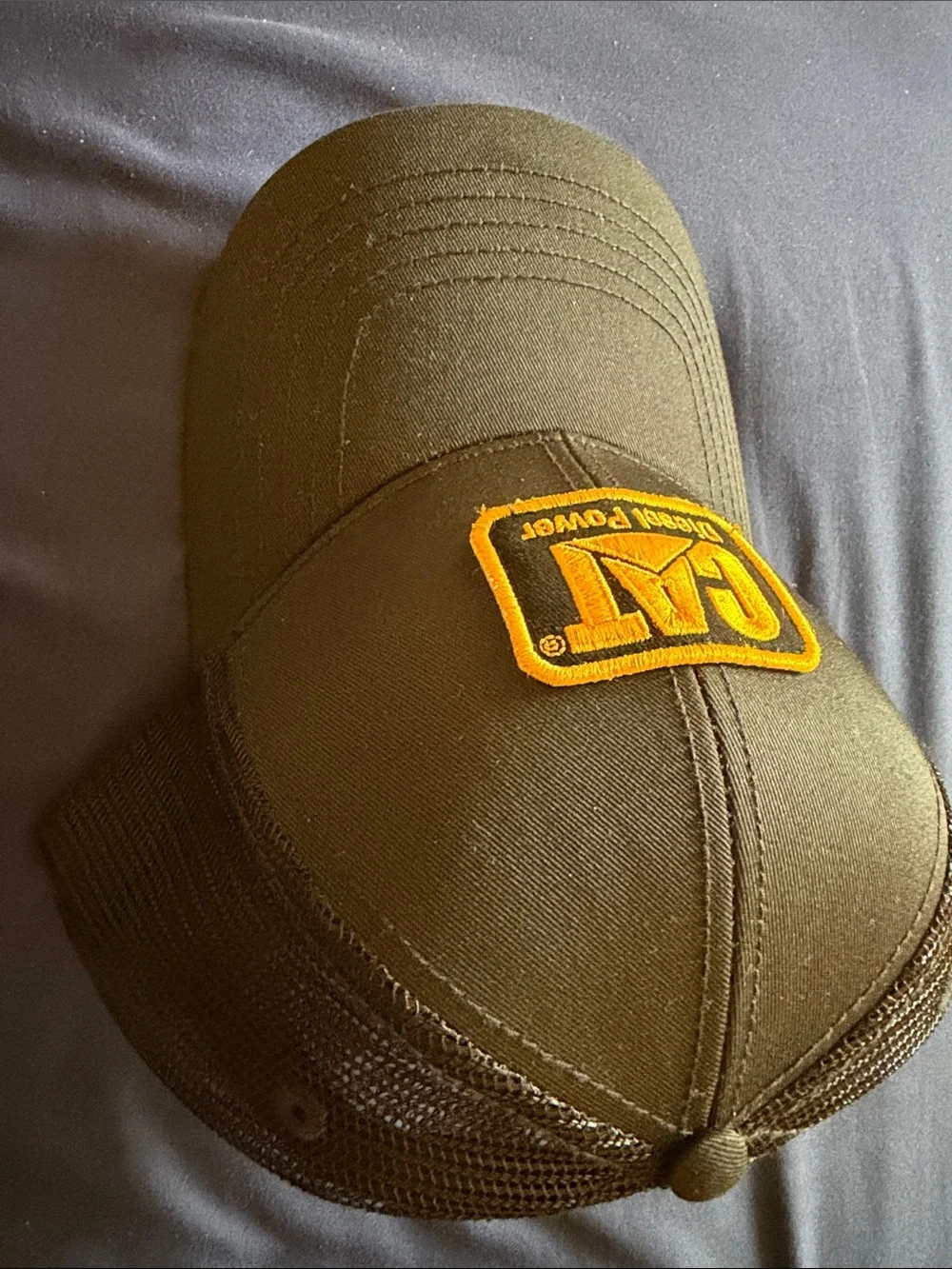 Caterpillar Black Trucker Cap with Yellow Logo